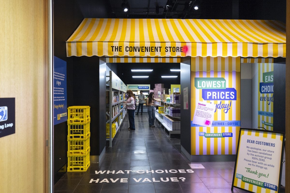 A group of people inside a supermarket like shop.