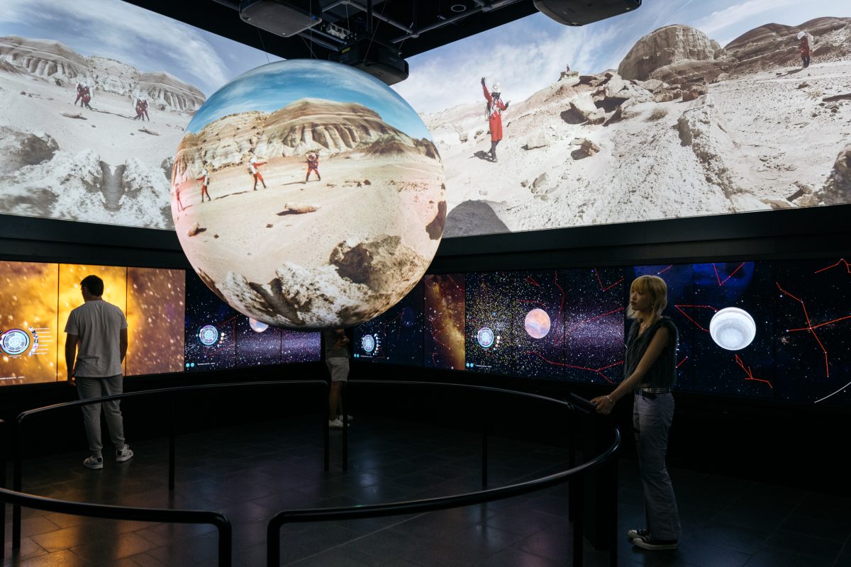 Universal Gallery with Sarah Jane Pell work on projection layer and sphere, World Wide Telescope on the touchscreens