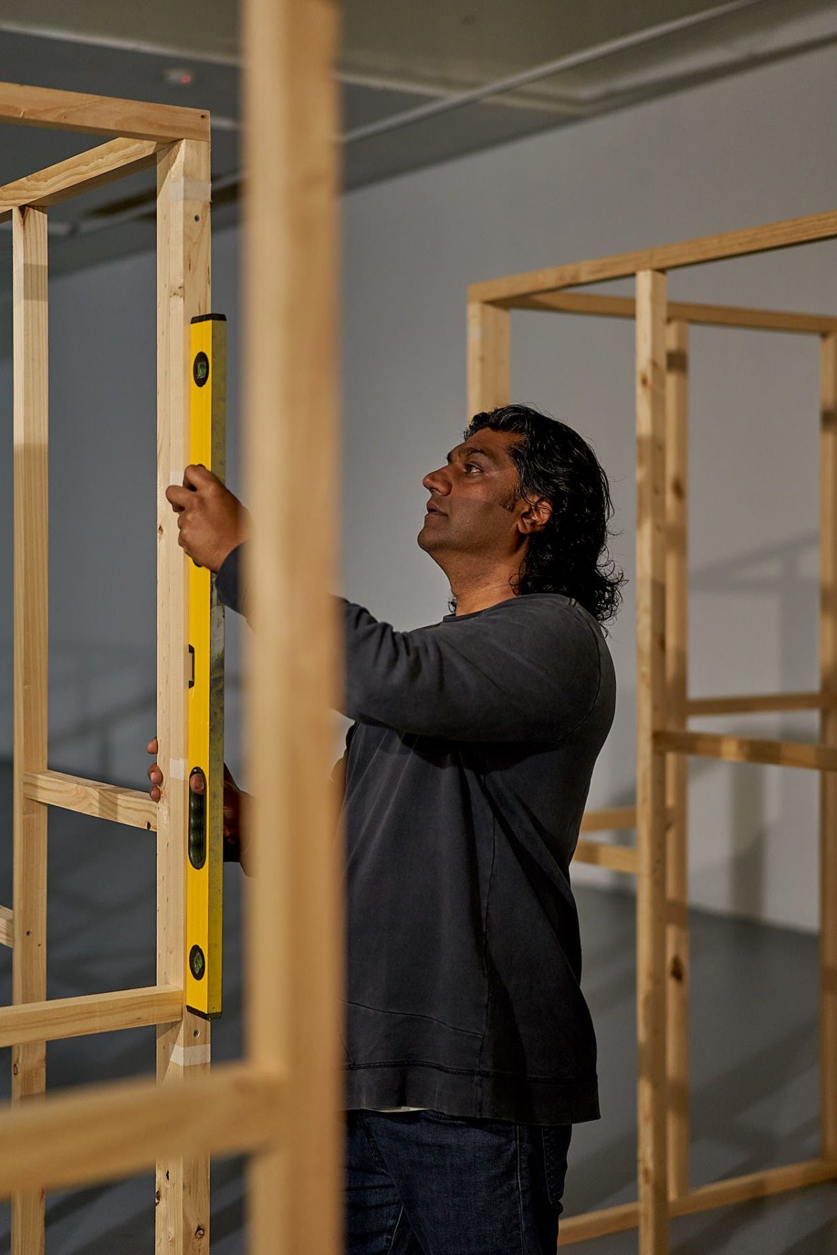 Yusuf Hayat working on wooden structure