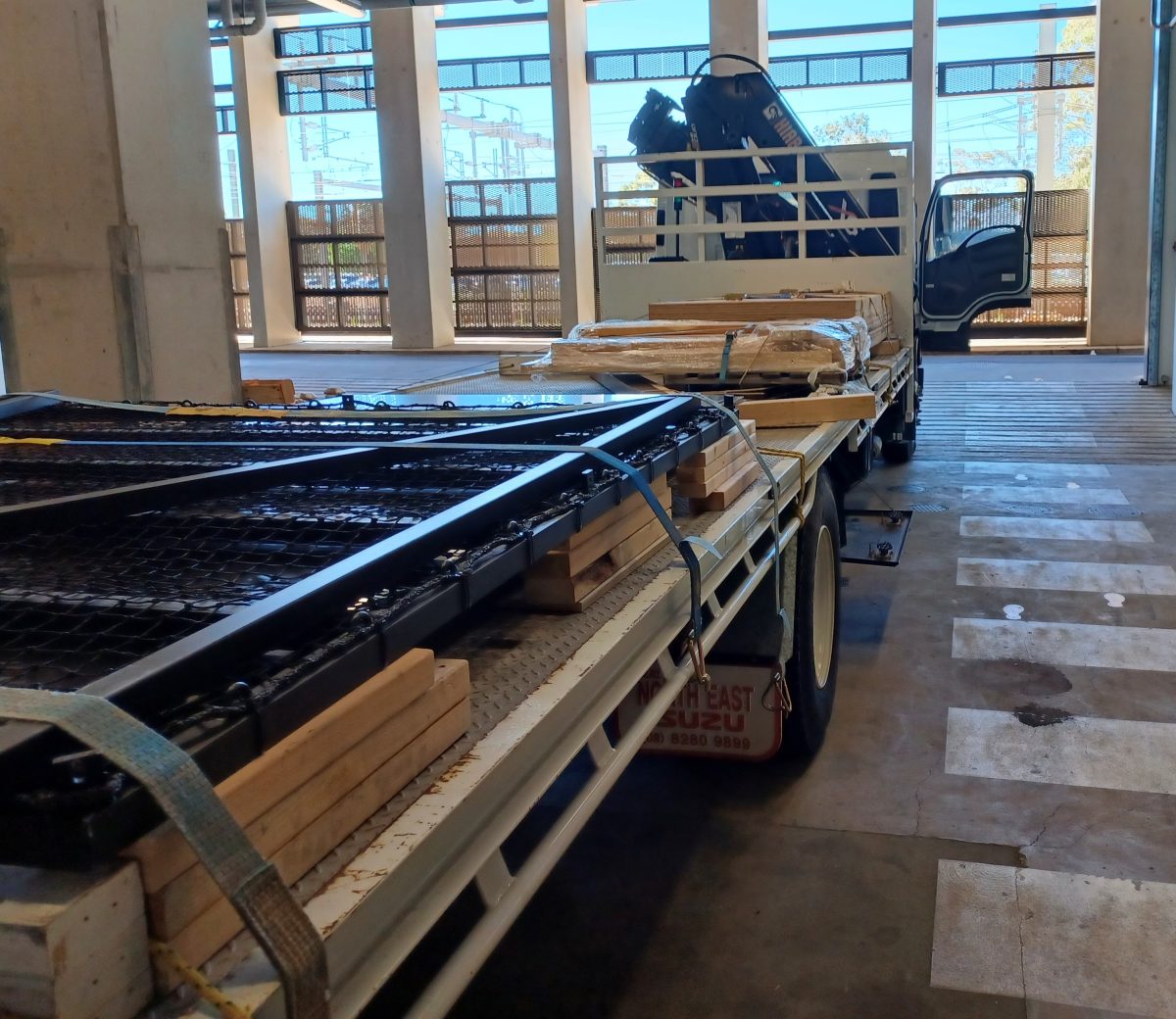 Flatbed truck loaded up with timber offcuts