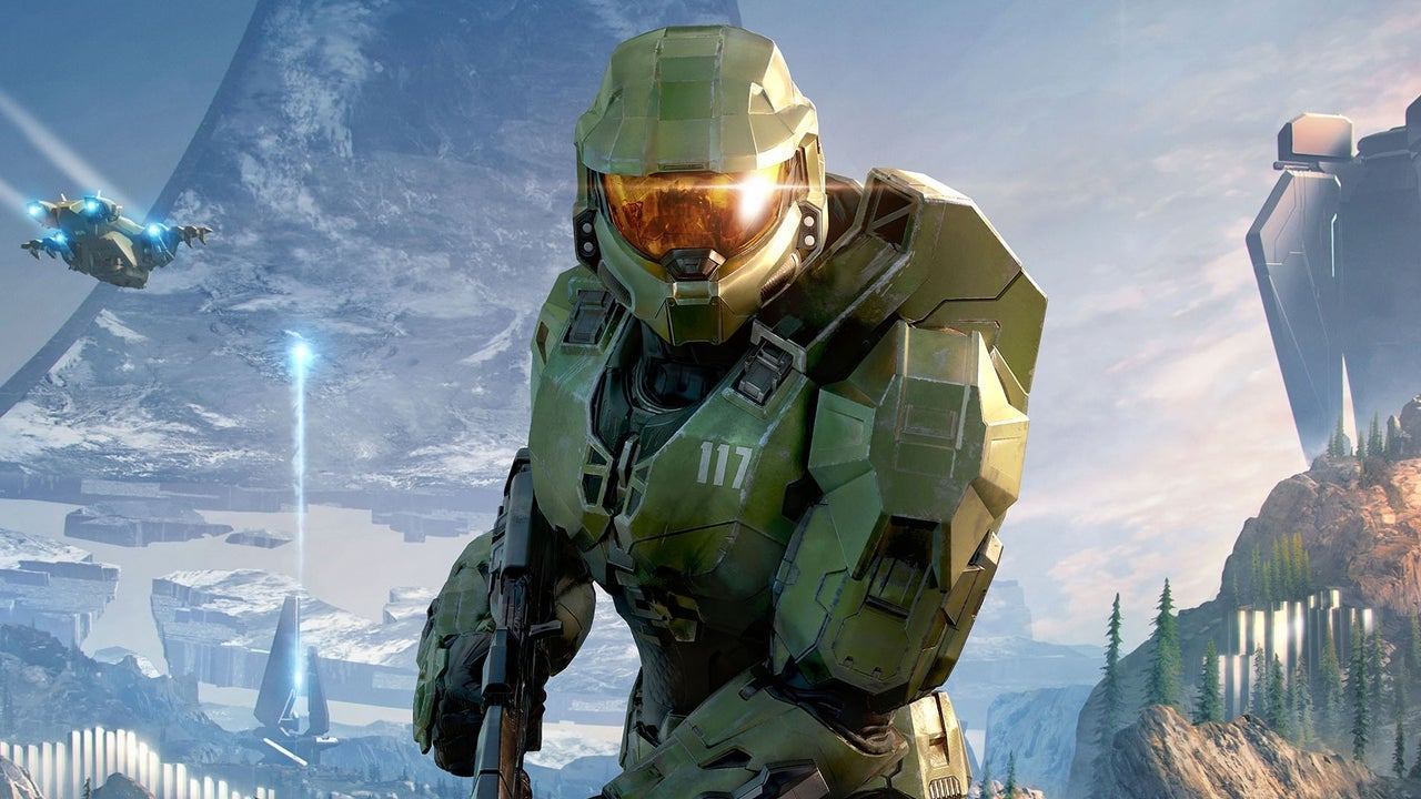 Masterchief, soldier from Halo, looks at you from the centre of an intergalactic place. They're wearing a robot outfit.